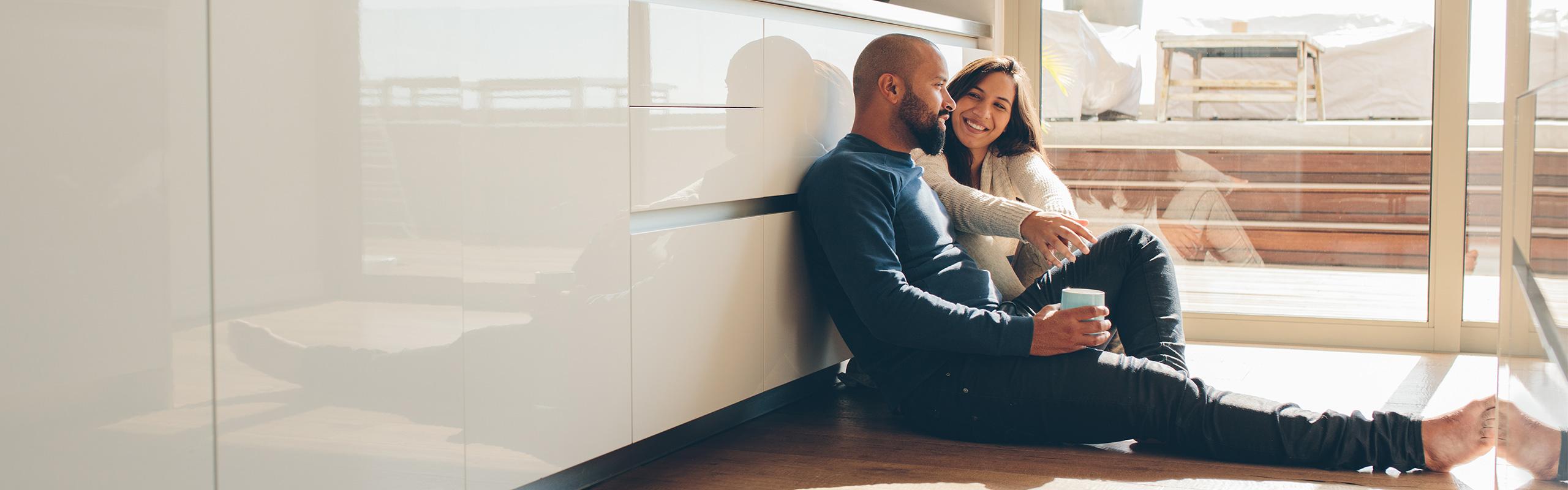 A young couple on the kitchen floor