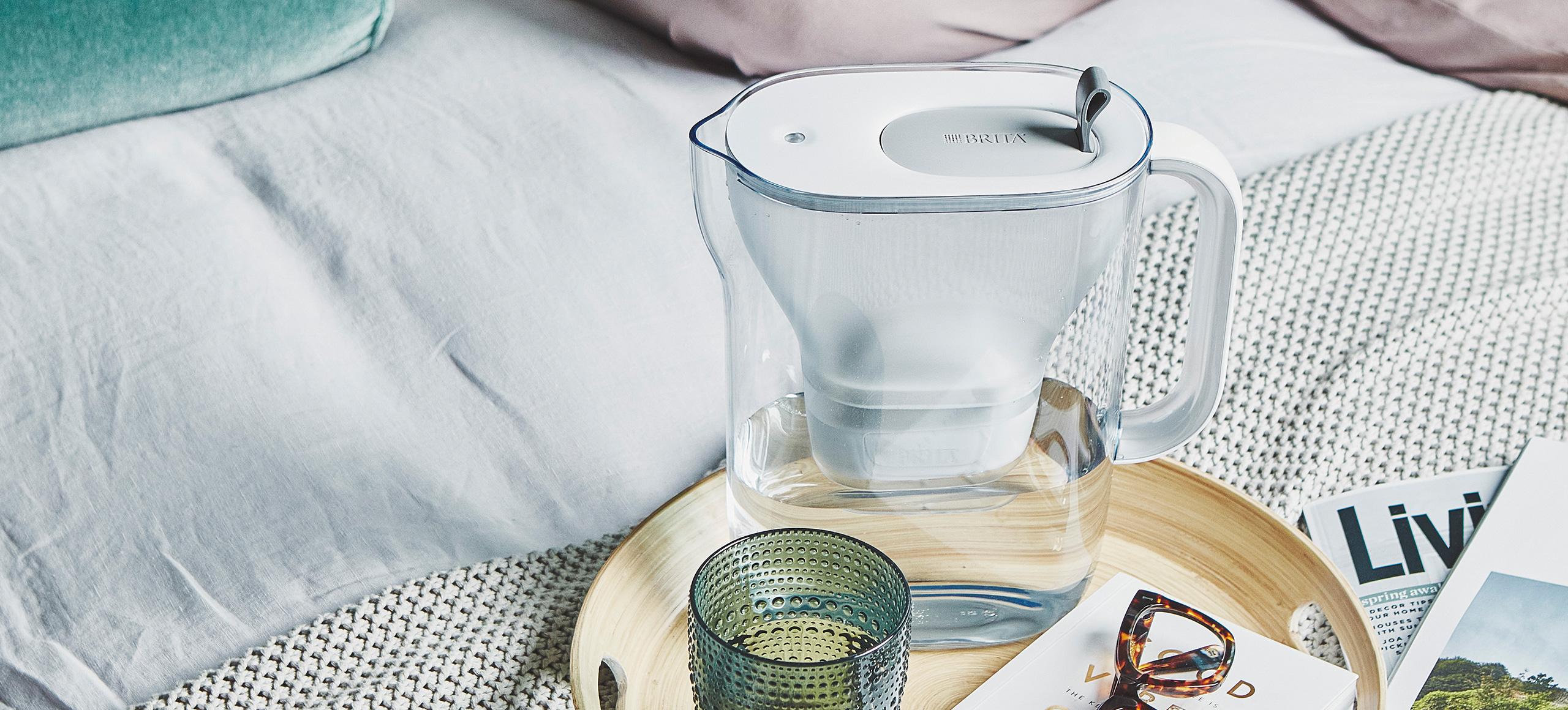 BRITA Style white and grey water filter jug on tray