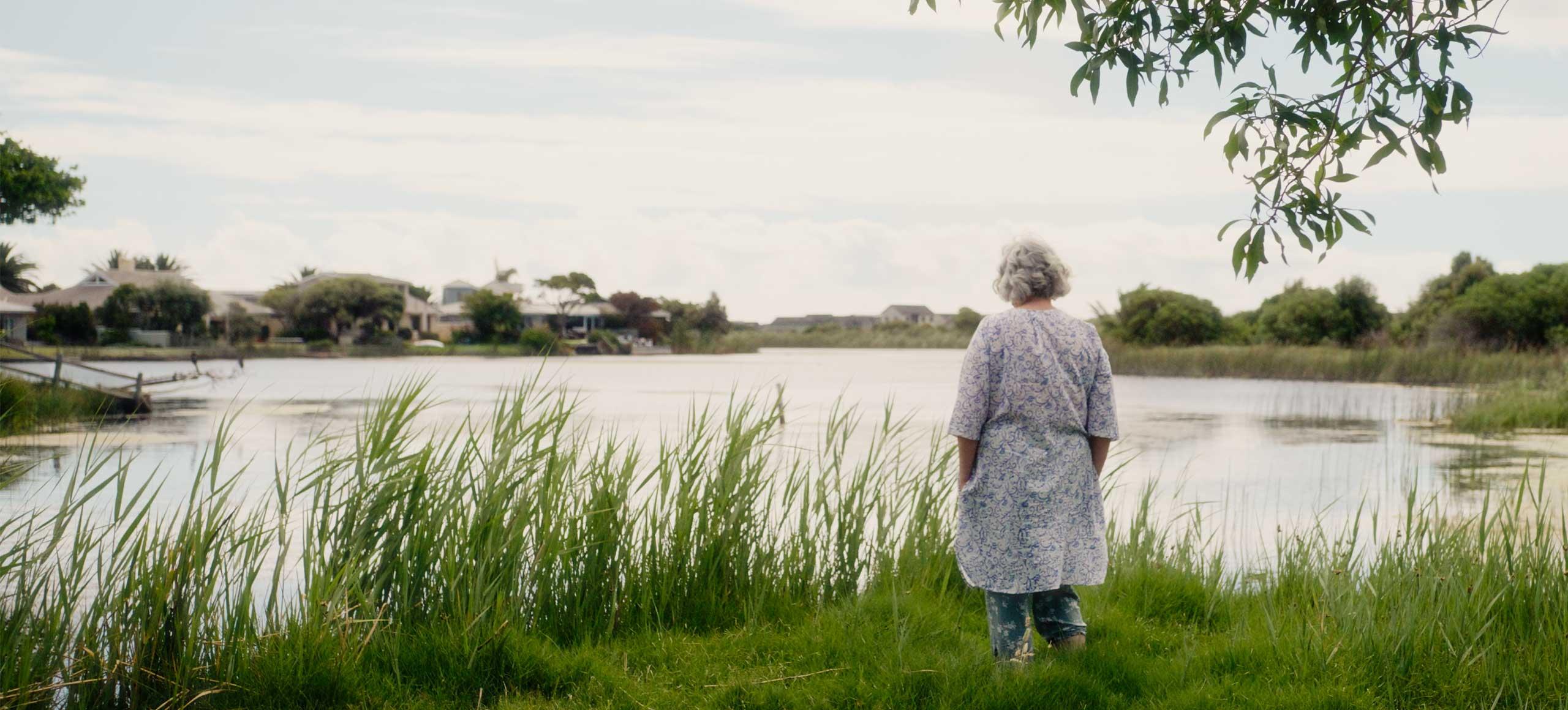 Woman standing by a lake in South Africa