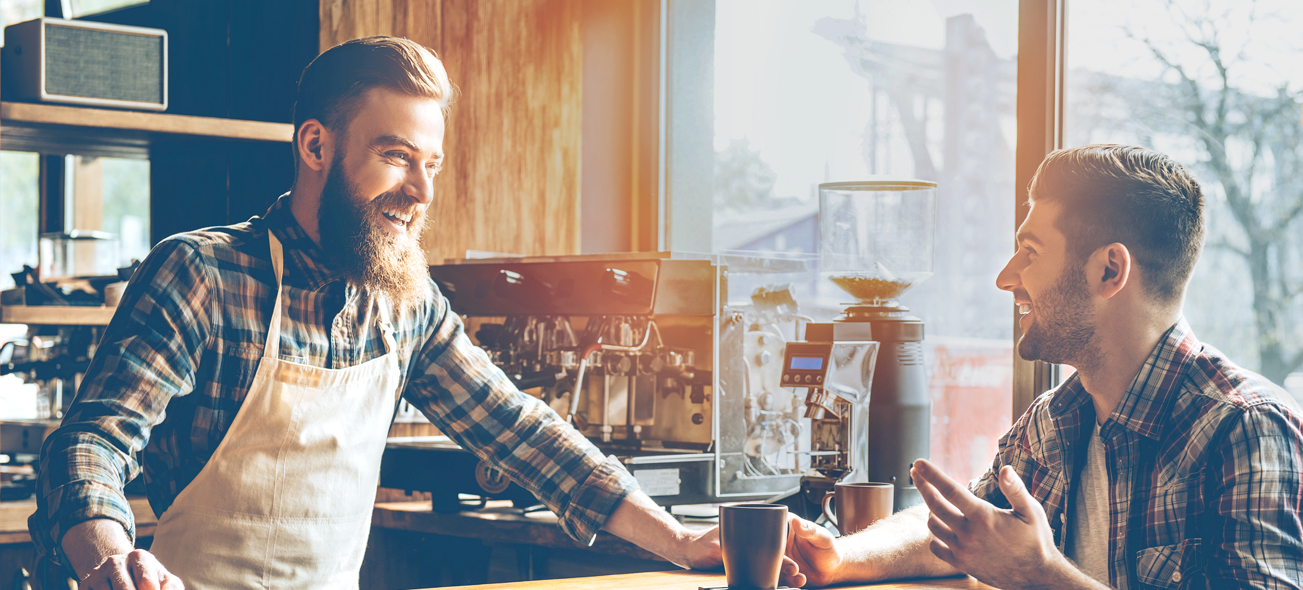Two men talking in coffee shop